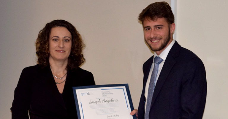 Erin Mulloy, President of SIFM, Presents the SIFM 2020 Scholarship to Joseph Angelina.  It was presented at Board meeting of the Maguire Academy of Insurance and Risk Management of St Joseph’s University, December 12, 2019